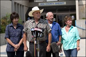 Standing out in front of the Ada County Sheriff's Office in Boise, witnesses, from left to right, Mary Young, Mike Young, Mark John, and Christa John speak with news reporters Sunday about their sighting of Hannah Anderson and James DiMaggio.