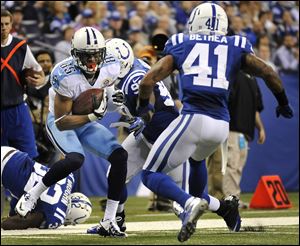 Titans wide receiver Nate Washington looks to get past the Colts’ Jerry Hughes (92) and Antoine Bethea (41) last season. Washington, a Scott High graduate who played at Tiffin University, is about to enter his ninth NFL season. He spent four seasons with Pittsburgh.