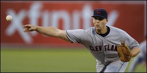 Cleveland Indians' Justin Masterson works against the Oakland Athletics in the first inning.