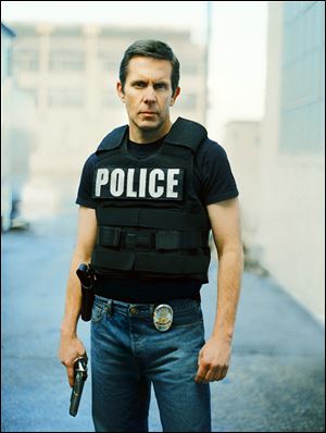 In this publicity photo released by TNT, Gary Cole portrays SWAT officer Conrad Rose in the new TNT cop drama 