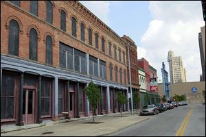 Vacant buildings along St. Clair Street would be refurbished and loft apartments and condominiums would be added. The buildings adjoining Fifth Third Field would include an expanded Swamp Shop, and a restaurant and bar would be added to the mix. 