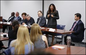 Anita Lopez briefly told the group about her upbringing in Toledo's Old South End and talked about growing up in poverty.