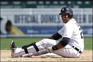 Detroit Tigers' Miguel Cabrera grabs his leg after being tagged out sliding into second base against the Oakland Athletics in the fifth inning of a baseball game today in Detroit.