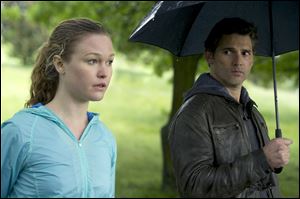 Julia Stiles, left, and Eric Bana in a scene from 'Closed Circuit.'