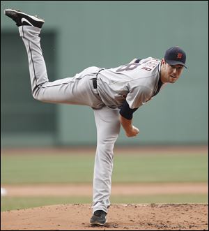 Detroit Tigers starting pitcher Doug Fister delivers against the Boston Red Sox during the first inning.