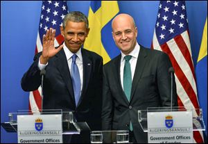 President Obama, left, with Swedish Prime Minister Fredrik Reinfeldt, smile during their news conference at the chancellery Rosenbad in Stockholm, Sweden today.