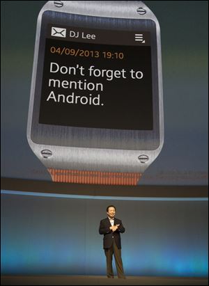 JK Shin, head of Samsung Mobile Communications, presents the Samsung Galaxy Gear in Berlin, Germany, Wednesday. Samsung has unveiled a highly anticipated digital wristwatch well ahead of a similar product expected from rival Apple.