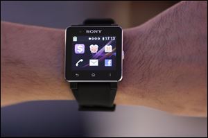 A man shows a Sony Smart Watch II  at  a Sony event ahead of the IFA, one of the world's largest trade fairs for consumer electronics in Berlin Wednesday.