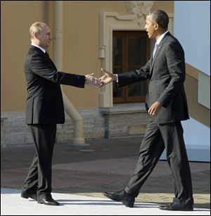 President Obama greets President Vladimir Putin during  the G-20 summit last week in St. Petersburg, Russia. The leaders are at odds over how to handle escalating violence in Syria.