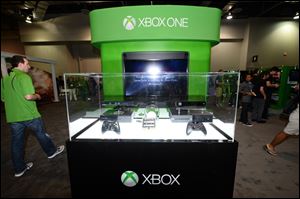 Display for the Microsoft Xbox One console at GameStop Expo, in Las Vegas.