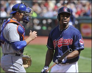 Cleveland's Michael Bourn has some words for home plate umpire Paul Emmel after being called out on strikes Sunday afternoon.