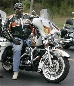 Toledo Mayor Mike Bell sits on on his Harley-Davidson motorcycle at the Harley dealership on Central Avenue during ‘Ride for Kids’ Sake’ in 2010.