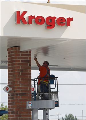 Dale Ault of County Fire installs a fire suppression system at the gas station of the new Kroger on Conant Street at Dussel Road in Maumee. The 86,000-square-foot store is part of a resurgence of retail building that includes an Art Van store in Springfield Township that opened recently.