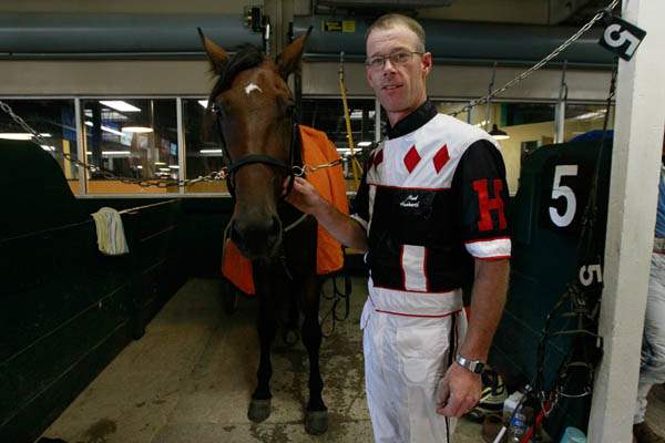 Driver-Mark-Headworth-stands-next-to-the-horse-M