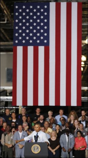 President Barack Obama chastises Republicans during his visit to the Ford Kansas City Stamping Plant in Liberty, Mo. 