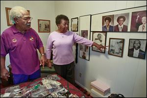 Norman and Ora Bell, Mayor Mike Bell's parents, talk about their family history while looking at photos at their home on Stickney Avenue. The Bells moved to Toledo from Louisiana.