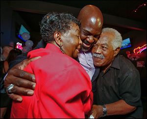 Mayor Mike Bell celebrates winning Toledo’s primary election with his parents, Ora and Norman Bell, Sr. The mayor said family is a driving force for him.