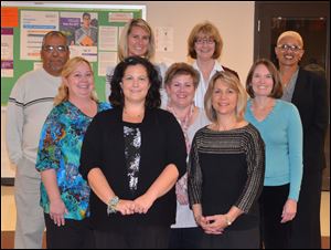 Front row (L-R): Tami Blue, Northview interactive media teacher and Lynn Nedrow, Timberstone science teacher (teacher of the year).     Middle row (L-R): Carolyn Akins, Timberstone custodian, Stacy Anderson, Timberstone parent and Nicole Greenberg, Sylvan parent.     Back row (L-R): Juan Rodriguez, McCord Para/Bus Driver, Lindsay Denny, Stranahan 2nd grade teacher, Joan McCarthy, Sylvan 4th grade teacher and Dawn Watson, District custodial supervisor.  (Not pictured are Rose Albert, Hill View office secretary and Shelly Ferris, Sylvan volunteer.)