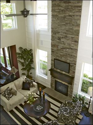 The dramatic stone fireplace rises two stories in the great room.