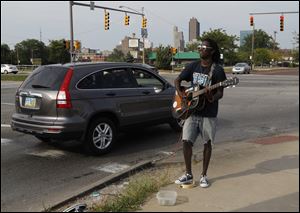 Earl Cookie busks at the High Level Bridge.