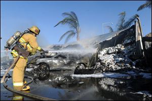 Fire officials said one person was transported in a big rig crash and fire that caused about a $1 million in damage at a Carmax in Oxnard, Calif.