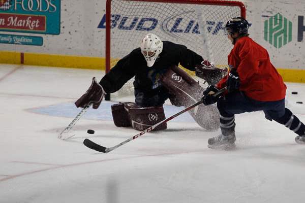 Walleye-goalie-Brooks-Ostergard-defends-against-teammate-and-center-Alden-Hirschfeld