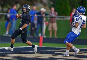 Perrysburg receiver Seth Durham finds the end zone against AW's Josh Schwerer in the first quarter on a 53-yard TD catch. Durham finished with four catches for 124 yards.