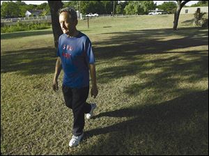 Kenyon Albrecht, 73, has osteoporosis, a disease common in elderly women. As part of his treatment he uses resistance training and walks.