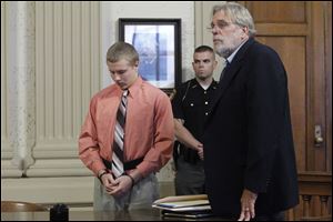 Michael Fay pleads guilty to the murder deaths of Blake and Blaine Romes in the Putnam County Common Pleas Court Tuesday. His attorney William Kluge stands with him.