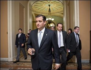 Tea party conservatives Sen. Ted Cruz, R-Texas, and Sen. Mike Lee, R-Utah, right, walk to a meeting.