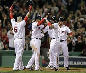 Boston Red Sox's Shane Victorino, second from right, celebrates his grand slam with Jonny Gomes, left, Xander Bogaerts, second from left, and Jacoby Ellsbury, right, in the seventh inning during Game 6 of the American League baseball championship series against the Detroit Tigers on Saturday.