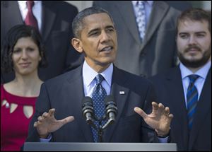 President Barack Obama speaks in the Rose Garden of the White House today on the initial rollout of the health care overhaul. 