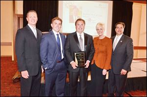 (From L to R) Alex Gerken, Senior Vice President, Fifth Third Bank,  Brad LaClair, Project Specialist, ProMedica (and son), Robert W. LaClair, President & CEO, Fifth Third Bank-Northwestern Ohio, Chrys Peterson, WTOL 11 News Anchor, Joe Napoli, President & General Manager, Toledo Mud Hens.