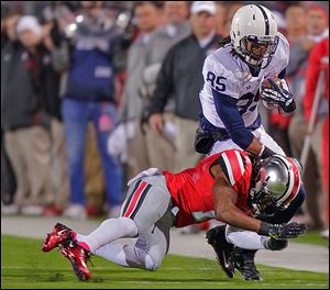 Penn State wide receiver Brandon Felder is tackled by Ohio State cornerback Bradley Roby on Saturday night in Columbus.