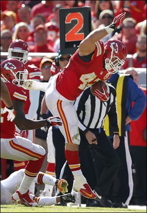 Chiefs fullback Anthony Sherman avoids a tackle on a touchdown run Sunday in Kansas City.