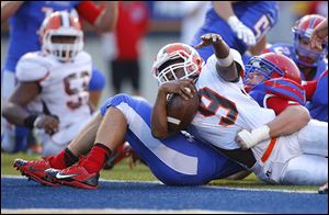 St. Franics senior John Fudacz stops Southview's Keith Gilmore near the end zone. The Knights are 8-2 and finished 6-1 in the TRAC.