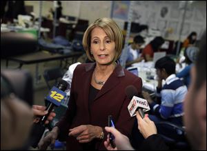 Democratic candidate for New Jersey governor, Barbara Buono, answers a question as she visits campaign workers and supporters in New Brunswick, N.J. Monday.