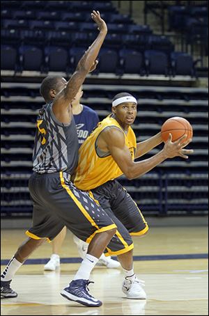 Toledo’s J.D. Weatherspoon, right, has played his way into a starting forward position for the Rockets this season.