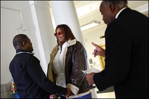 Ypsilanti, Mich., residents Mohammed Soumah and Katima Dickenson are wed by Rev. John Oliver at the Lucas County Courthouse 