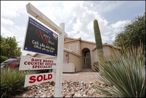 An existing home is listed as sold,  in Gilbert, Ariz. 