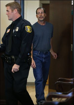 Theodore P. Wafer, 54, of Dearborn Heights, appears at his arraignment in 20th District Court in Deaborn Heights, Mich., today.