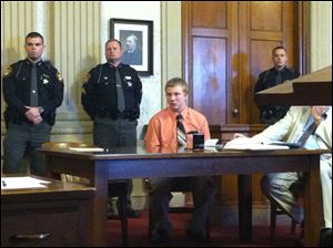 Michael Fay listens to Putnam County Common Pleas Judge Judge Randall Basinger sentence him to two consecutive life sentences, minimum of 60 years.