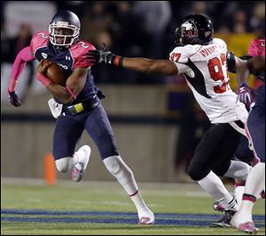 University of Toledo QB Terrance Owens (2) runs the ball against  Northern Northern Illinois today.