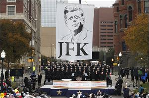 The U.S. Naval Academy Glee Club performs during the ceremony to mark the 50th anniversary of John F. Kennedy’s assassination in Dealey Plaza in Dallas. 