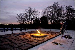 The eternal flame flickers at John F. Kennedy’s grave at Arlington National Cemetery. Jean Kennedy Smith, his only surviving sibling, and other relatives visited later Friday. 