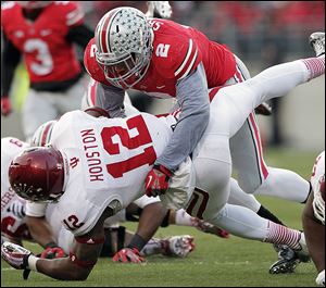 Ohio State linebacker Ryan Shazier tackles Indiana running back Stephen Houston during the second quarter on Saturday. The junior defensive leader had 20 tackles in Ohio State’s rout of Indiana.