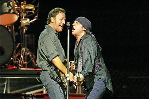 Bruce Springsteen, left, and Steven Van Zandt perform during the first show of the Bruce Springsteen & the E Street Band 2002-2003 world tour in East Rutherford, N.J.