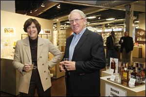 Stephanie Streeter, Libbey chief executive, and Richard Reynolds, the most senior member of the management team, appear at an open house for his retirement at Libbey’s factory showroom.