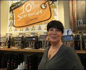 Stephanie Harmon, owner of Bumble Olive Oil Company at the Franklin Park Mall. The shop opened at five a.m., allowing all employees to have Thanksgiving Day off from work.