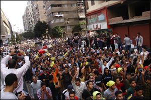 Supporters of Egypt's ousted President Mohammed Morsi hold a rally against a new law regulating protest in Cairo, Egypt, today.